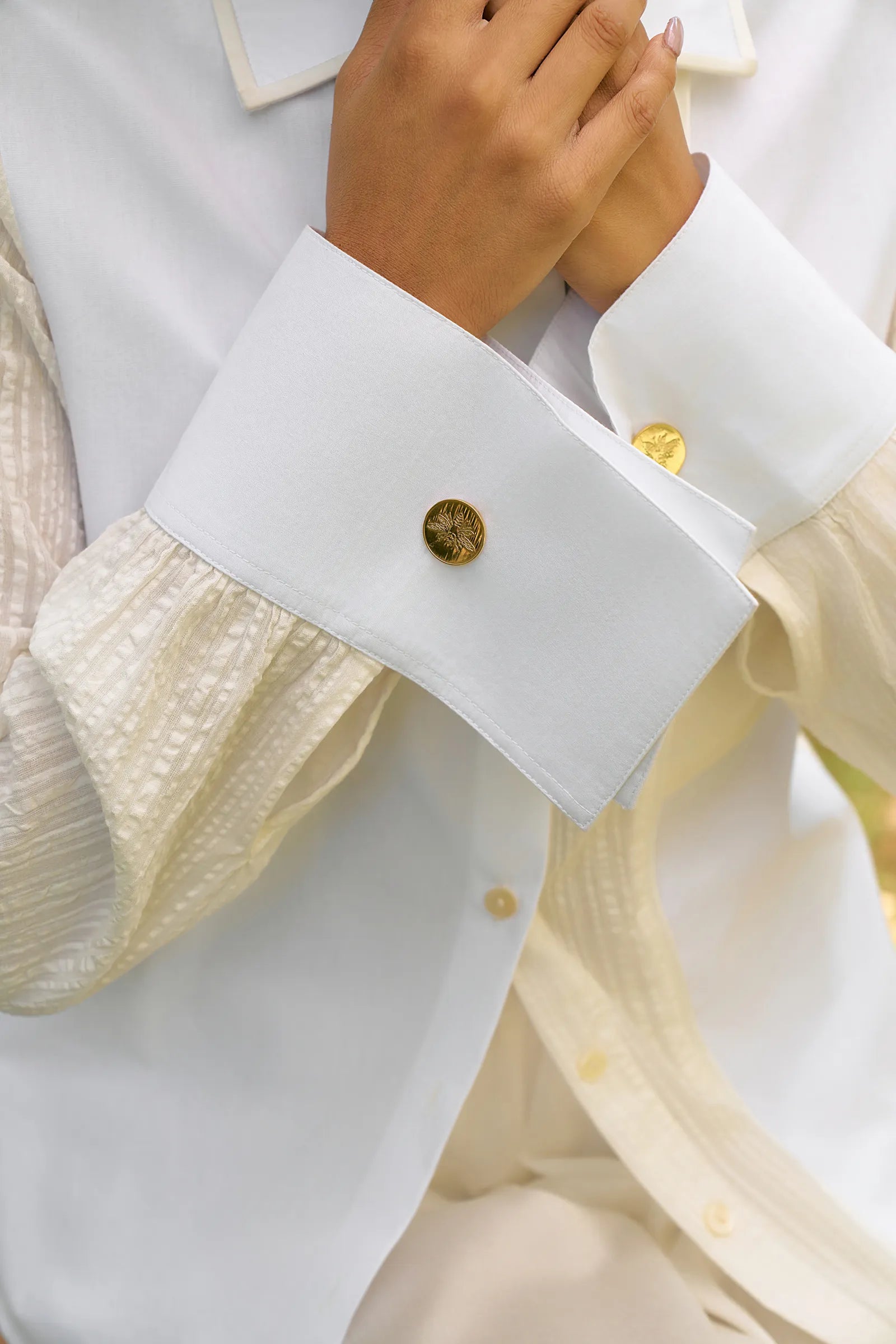 D'muri The Tailor's Panel Shirt close-up of the tailored shirt with gold buttons and cuffs.